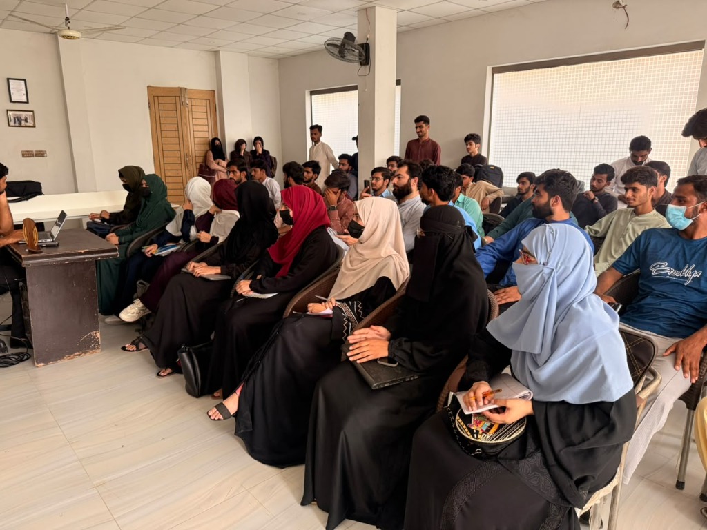 Female Students Taking Notes
